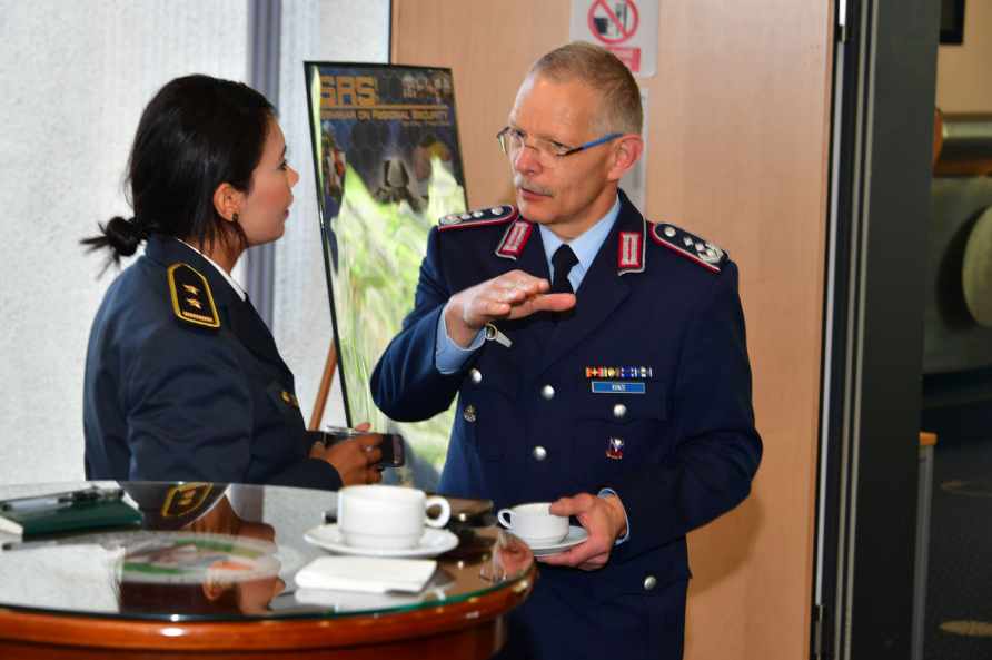 A photograph of participants in the SRS course 19-04 attending a reception.